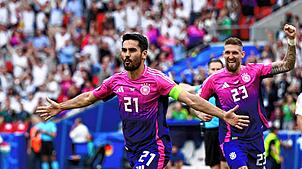 Deutschlands Kapitän Ilkay Gündogan (links) feiert seinen zum 2:0 gegen Ungarn. Die DFB-Auswahl (rechts Robert Andrich) steht nach dem ...