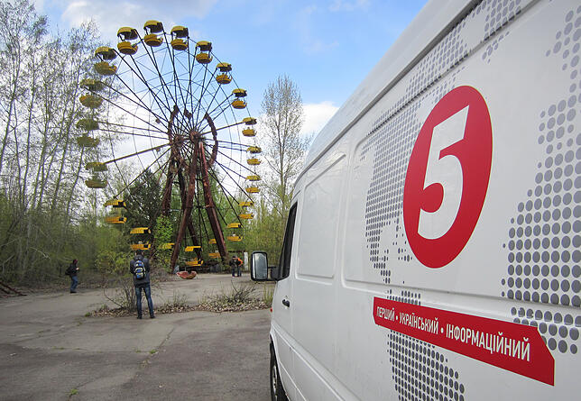 Ein für die sowjetischen Maifeierlichkeiten aufgebautes Riesenrad steht in der 1986 nach dem Atomunglück von Tschernobyl aufgegebenen ...